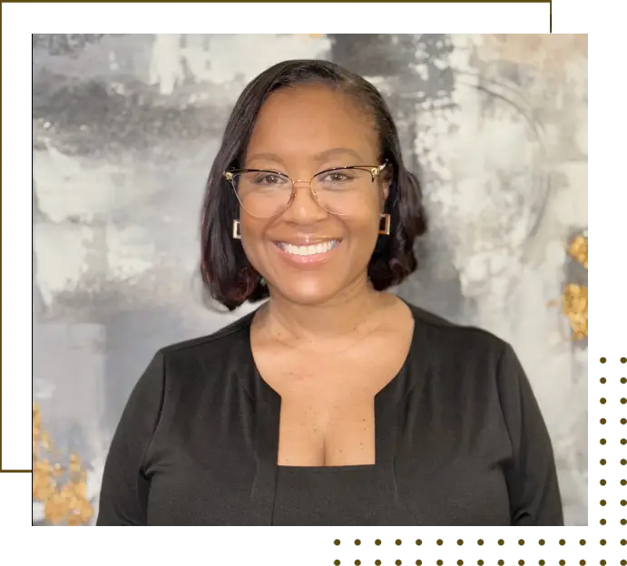 A woman in glasses and black shirt smiling.